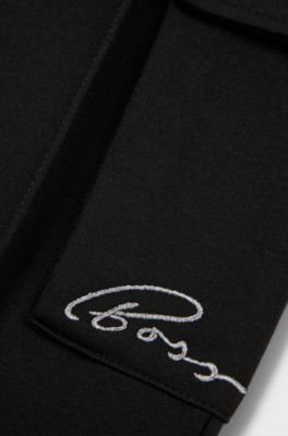 Kids' tracksuit bottoms with cargo pockets, Black