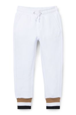 Kids' tracksuit bottoms in cotton with signature-stripe cuffs, White