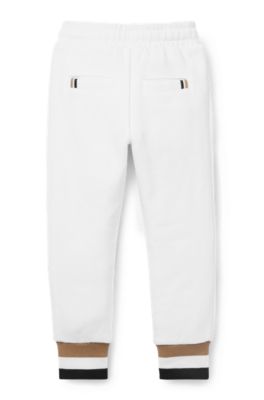 Kids' tracksuit bottoms in cotton with signature-stripe cuffs, White
