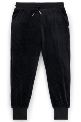 Kids' velvet trousers with embossed monogram detail, Black