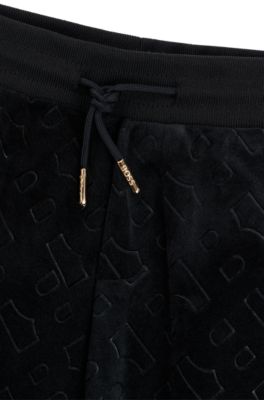 Kids' velvet trousers with embossed monogram detail, Black