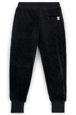 Kids' velvet trousers with embossed monogram detail, Black