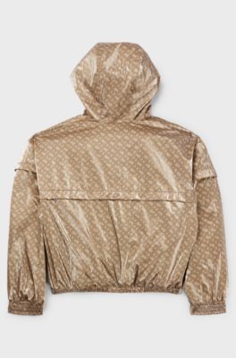 Giacca a vento per bambini con cappuccio e motivo con monogrammi, Beige