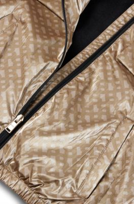 Kids' hooded windbreaker with monogram pattern, Beige