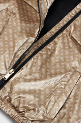 Kids-Windbreaker mit Kapuze und Monogramm-Muster, Beige