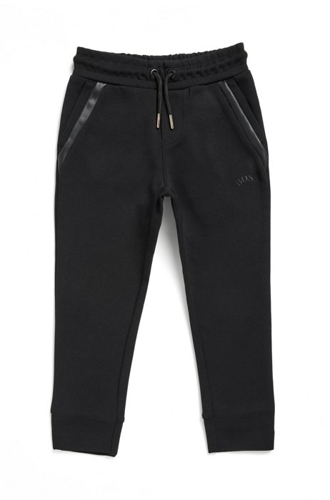 Kids' tracksuit bottoms with exclusive logo label, Black
