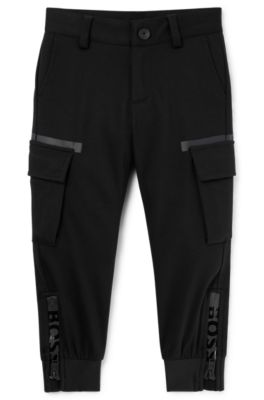 Kids' cargo trousers with zipped hems and striped label, Black