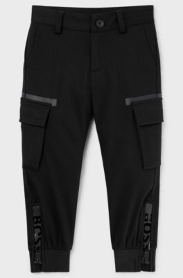 Kids' cargo trousers with zipped hems and striped label, Black