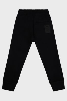 BOSS x AJBXNG Kids' cotton-blend tracksuit bottoms with exclusive logo print, Black