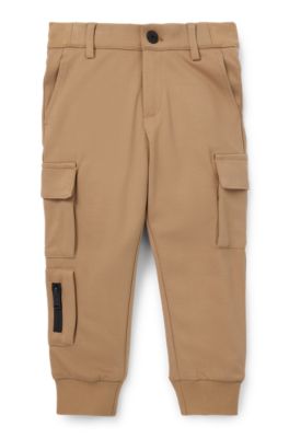 Kids' chino-fit cargo trousers in stretch piqu&eacute; fabric, Brown