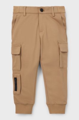 Kids' chino-fit cargo trousers in stretch piqu&eacute; fabric, Brown