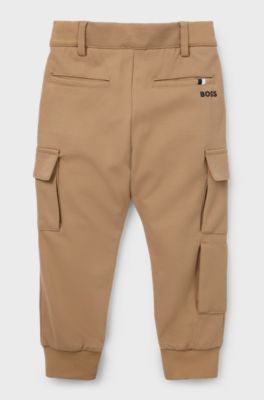 Kids' chino-fit cargo trousers in stretch piqu&eacute; fabric, Brown