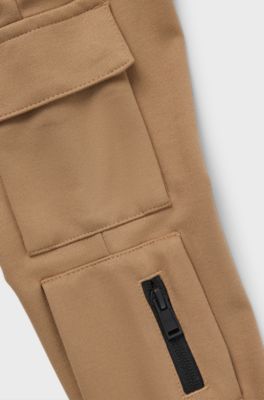 Kids' chino-fit cargo trousers in stretch piqu&eacute; fabric, Brown