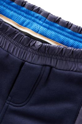 Kids' fleece tracksuit bottoms with cargo pockets, Dark Blue