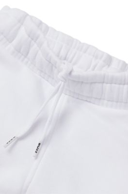 Kids' cotton-blend tracksuit bottoms with embossed logos, White