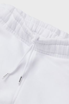Kids' cotton-blend tracksuit bottoms with embossed logos, White