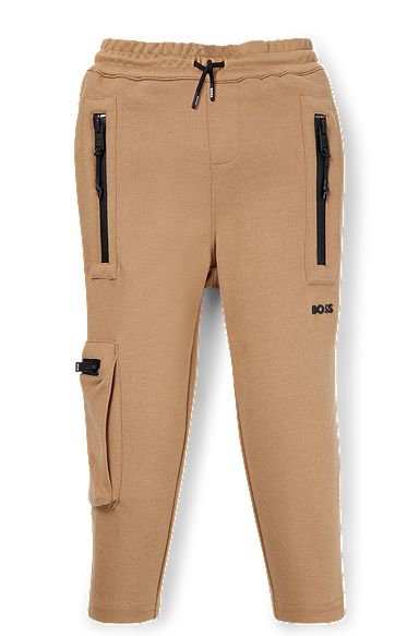 Kids' tracksuit bottoms in stretch piqué with patch pocket, Brown