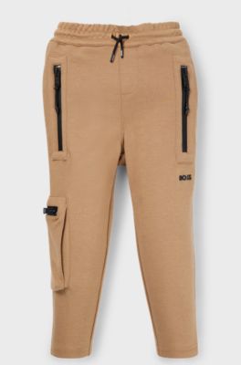 Kids' tracksuit bottoms in stretch piqu&eacute; with patch pocket, Brown