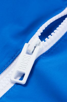 Kids' water-repellent hooded windbreaker jacket with printed logo, Blue