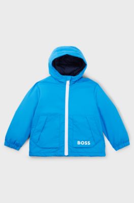 Kids' hooded windbreaker with appearing monogram pattern, Blue