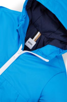 Windjack voor kinderen met capuchon en verborgen monogramdessin, Blauw