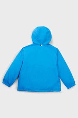 Kids' hooded windbreaker with appearing monogram pattern, Blue