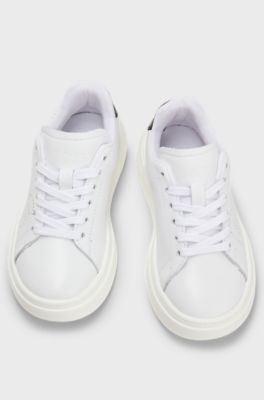 Kids' lace-up trainers in leather with perforated logo, White