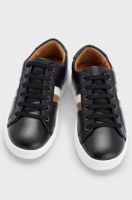 Kids' lace-up trainers in leather with signature stripe, Black