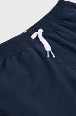 Kids' quick-dry swim shorts with vertical logo, Dark Blue