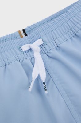Kids' quick-dry swim shorts with vertical logo, Light Blue
