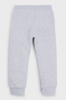 Trainingsbroek voor kinderen van fleece met verticale logoprint, Lichtgrijs