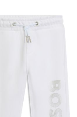 Kids' cuffed tracksuit bottoms with logo print, White