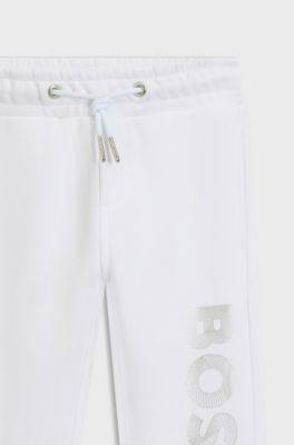 Kids' cuffed tracksuit bottoms with logo print, White