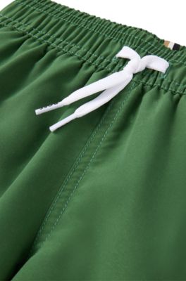 Kids' quick-dry swim shorts with vertical logo, Dark Green