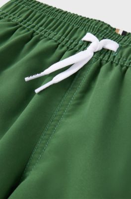 Kids' quick-dry swim shorts with vertical logo, Dark Green