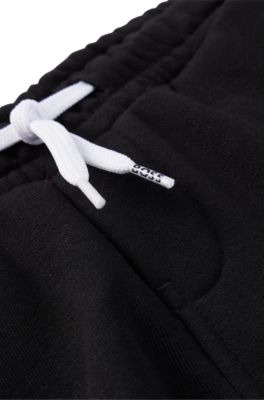 Tracksuit-byxor i fleece f&ouml;r barn med tryckt logga, Svart