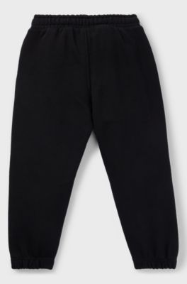 Kids' fleece tracksuit bottoms with logo print, Black