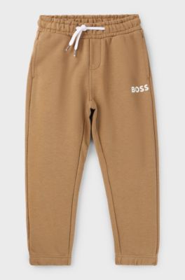 Kids' fleece tracksuit bottoms with logo print, Brown