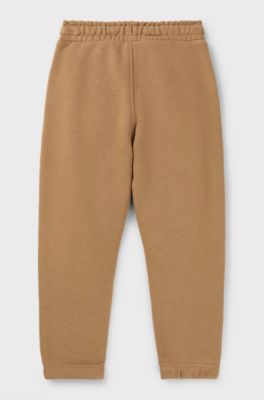 Kids' fleece tracksuit bottoms with logo print, Brown