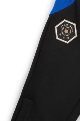 키즈 스트라이프 및 로고 디테일 트랙수트 팬츠, 블랙