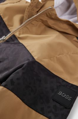 Kids' water-repellent hooded windbreaker with monogram detailing, Brown
