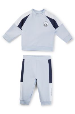 Baby tracksuit in stretch cotton with red-panda badge, Light Blue