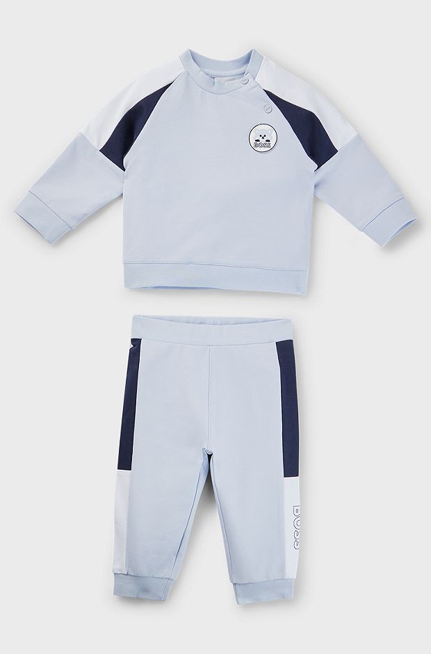 Baby tracksuit in stretch cotton with red-panda badge, Light Blue