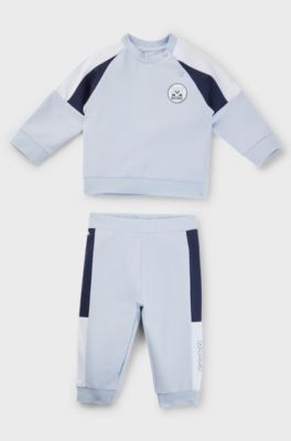 Baby tracksuit in stretch cotton with red-panda badge, Light Blue