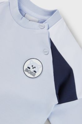 Baby tracksuit in stretch cotton with red-panda badge, Light Blue