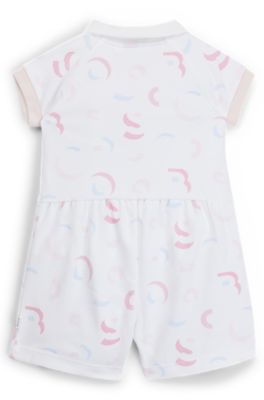 Baby playsuit in interlock cotton with printed logo pattern, Patterned