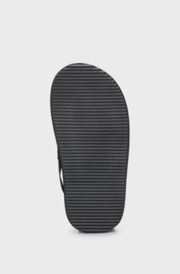 Kids' slides with ankle strap and branding, Black
