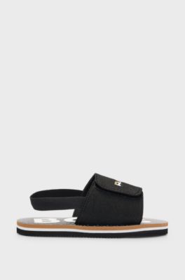 Kids' slides with ankle strap and branding, Black