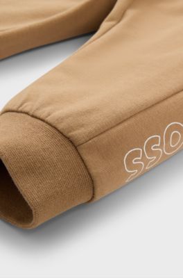 Baby tracksuit in stretch cotton with logo prints, Brown