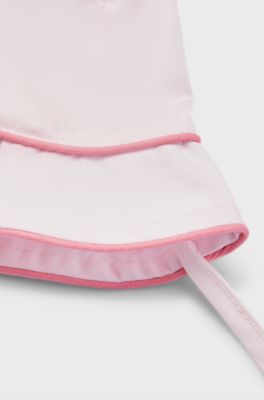 Baby hat in cotton with cords and logo print, light pink